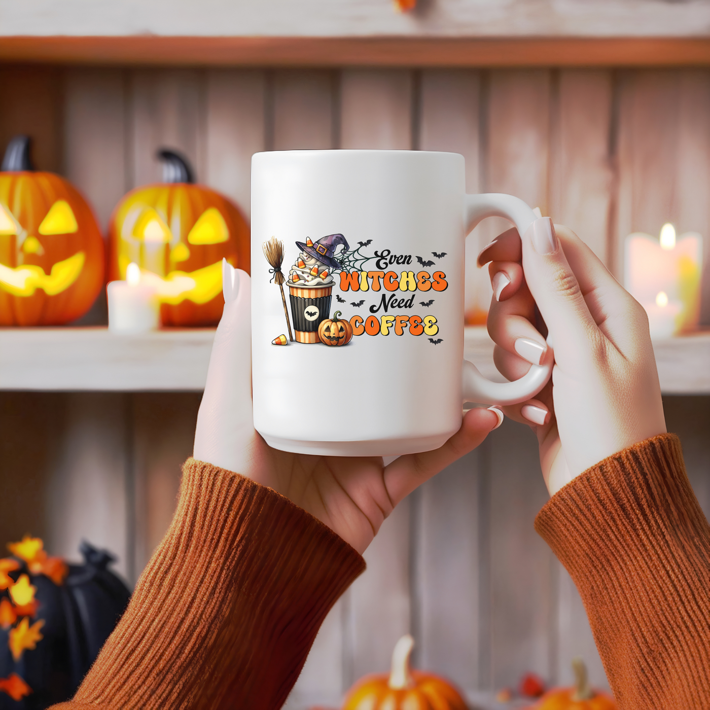 a woman holding a white coffee mug with a witch on it