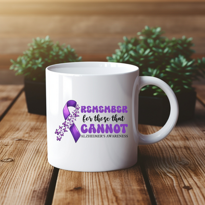 a white coffee mug with a purple ribbon on it