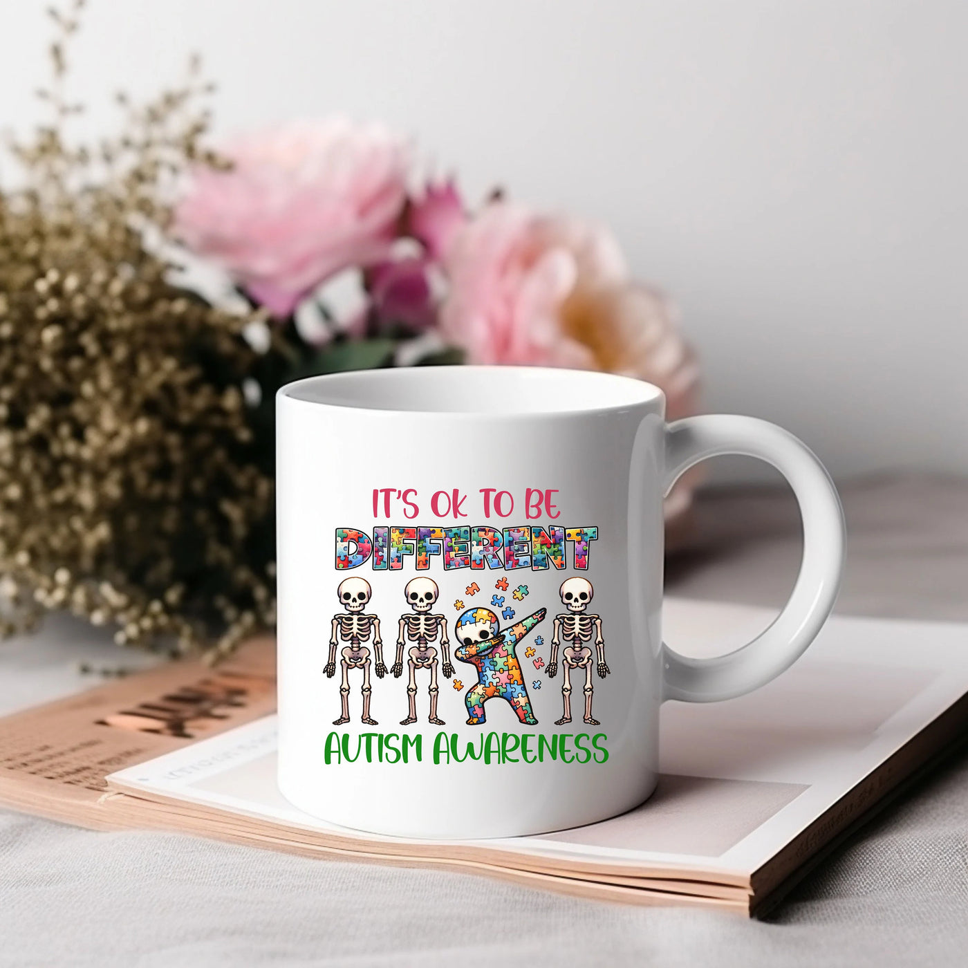 a white coffee mug with a picture of skeletons on it