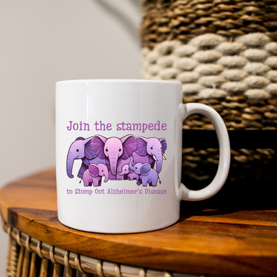 a coffee mug with a picture of three elephants on it