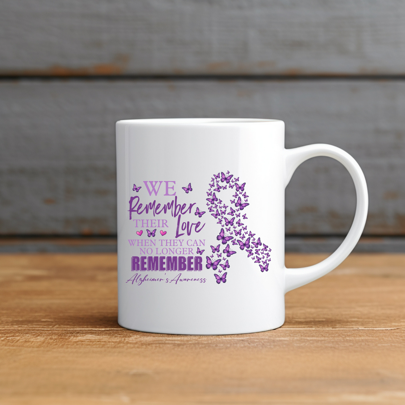 a white coffee mug with a purple ribbon on it