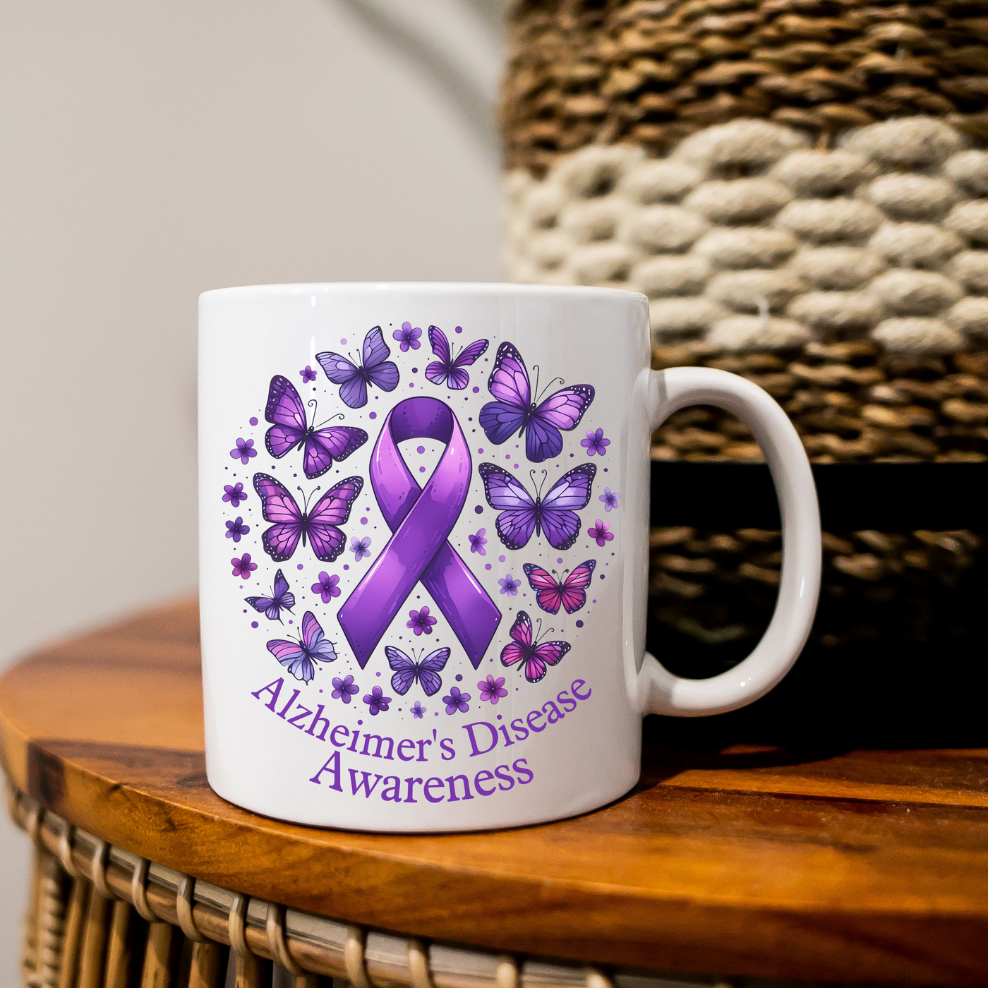 a white coffee mug with a purple ribbon on it