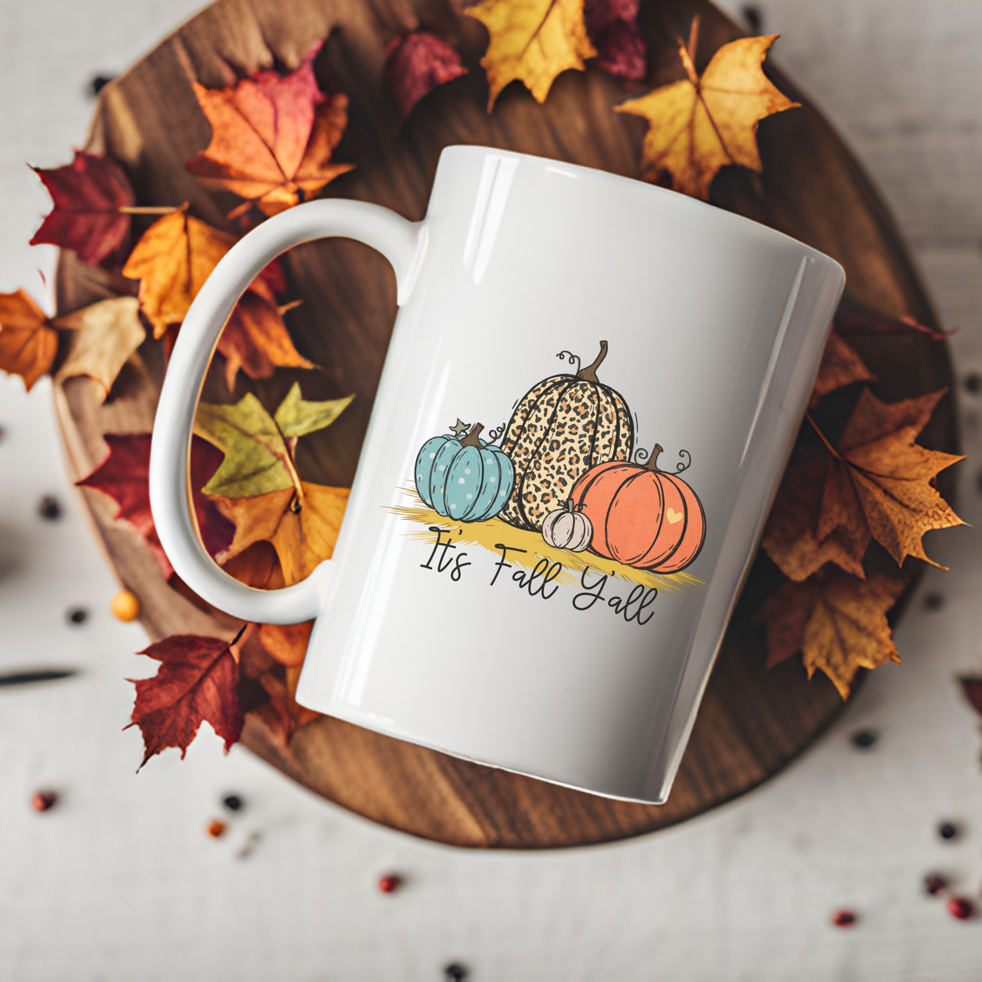 a white coffee mug with a picture of a pumpkin on it