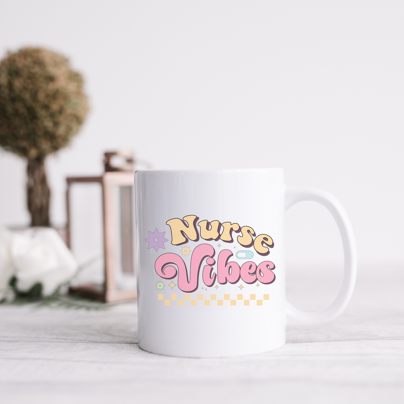 a white coffee mug sitting on top of a table