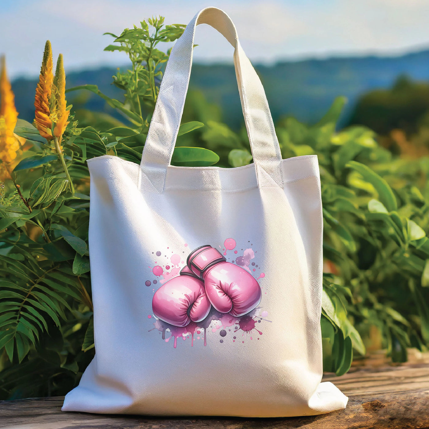 a white bag with pink boxing gloves on it