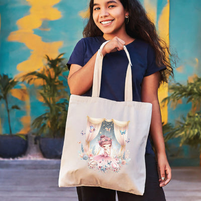 a woman holding a tote bag with a picture of a woman on it