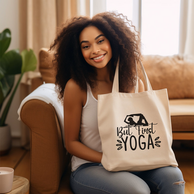 a woman sitting on a couch holding a tote bag