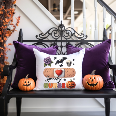 a bench with two pumpkins and a pillow on it