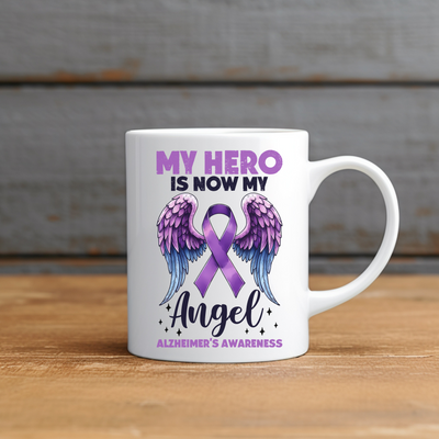 a white coffee mug with a purple ribbon on it