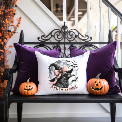 a bench with two pumpkins and a pillow on it