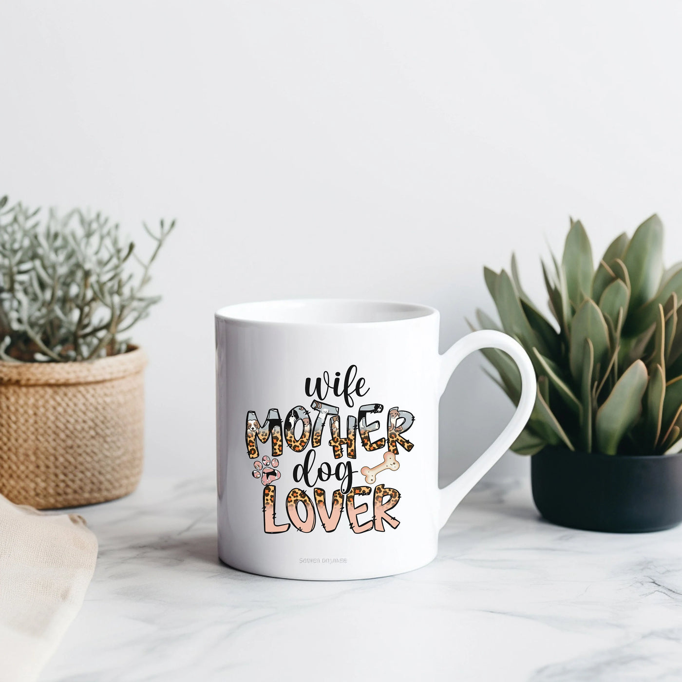 a white coffee mug sitting on top of a table