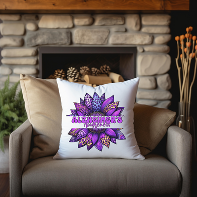 a pillow with a purple flower on it sitting on a chair in front of a