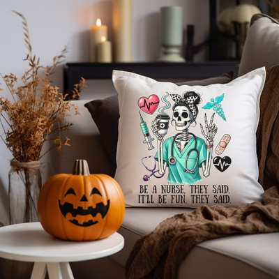 a pillow with a skeleton on it sitting on a couch