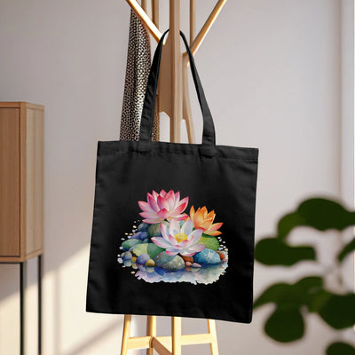 a black tote bag with a picture of flowers on it