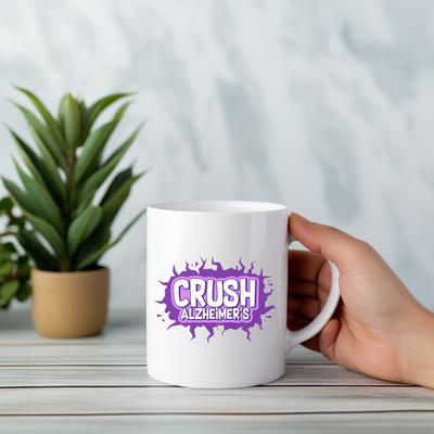 a person holding a coffee mug with the word crush alcheme's on