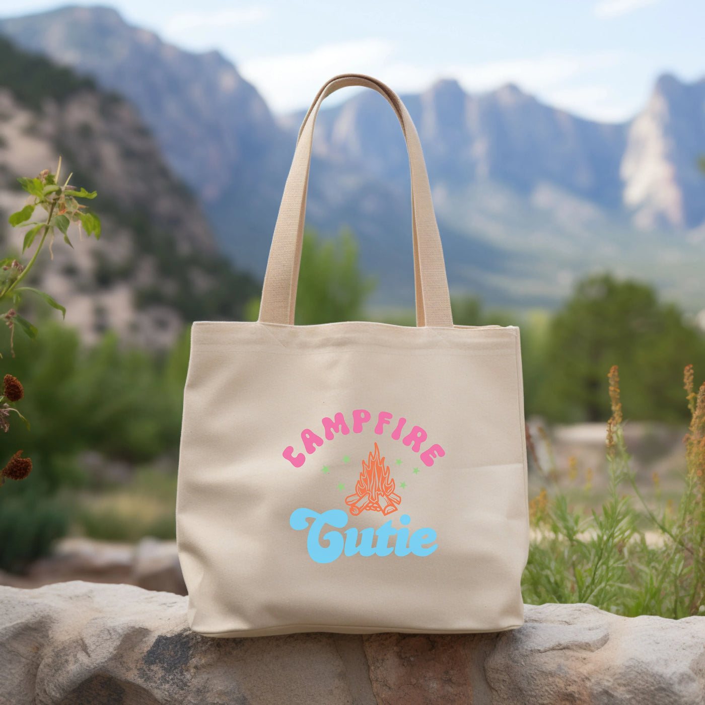 a tote bag sitting on top of a rock