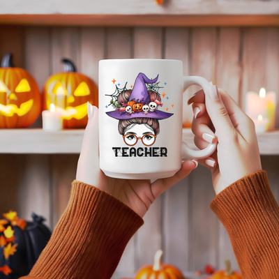 a person holding a coffee mug with a witch on it