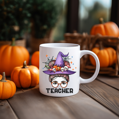 a white coffee mug with a witch on it