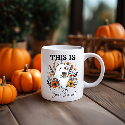 a white coffee mug sitting on top of a wooden table