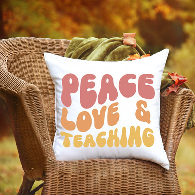 a chair with a pillow that says peace love and teaching