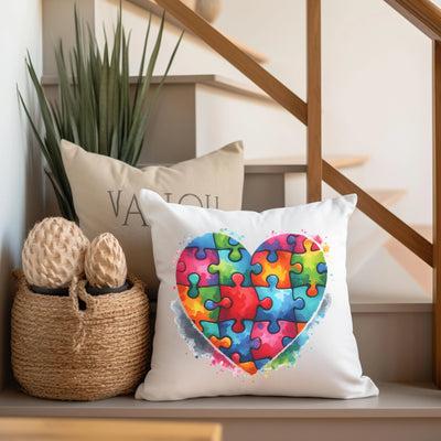 a pillow with a heart made out of puzzle pieces