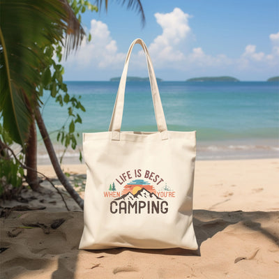 a white bag sitting on top of a sandy beach