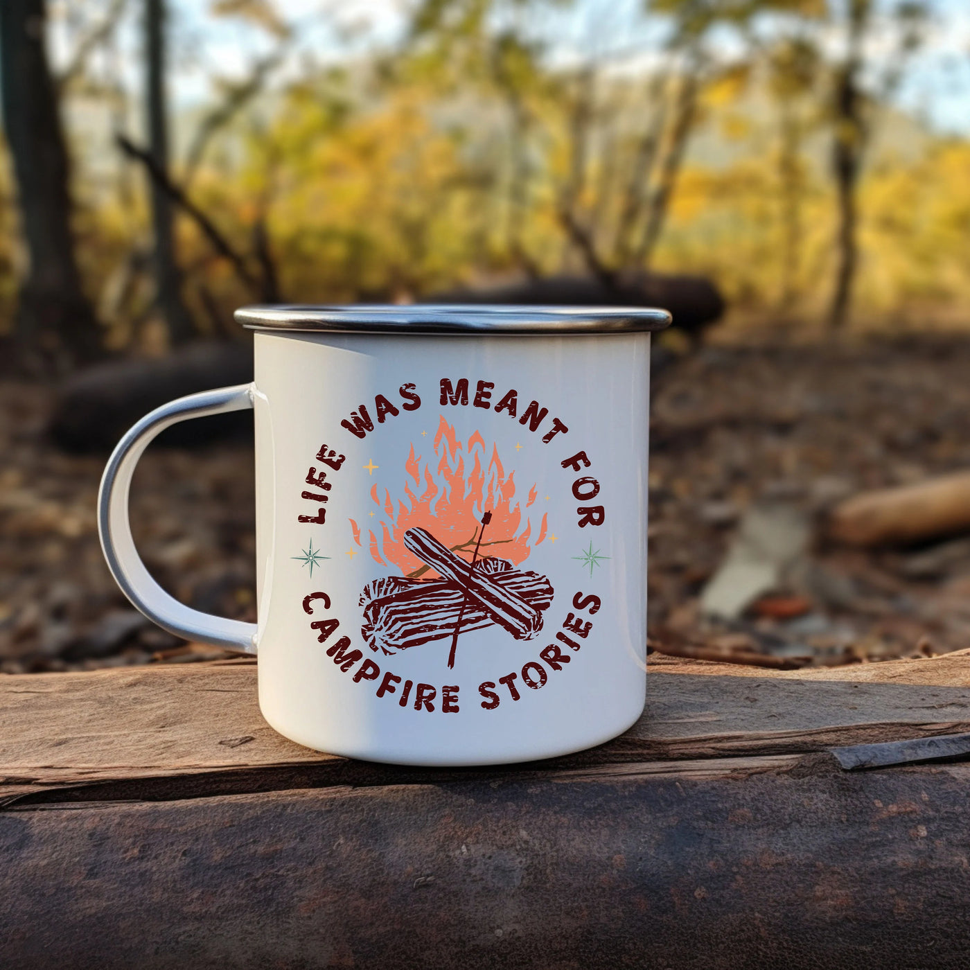 a campfire mug sitting on top of a piece of wood