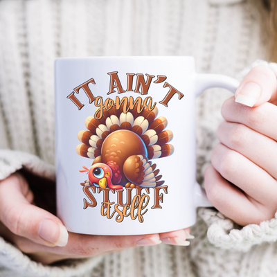 a woman holding a coffee mug with a turkey on it