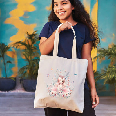 a woman holding a bag with a picture of a girl on it