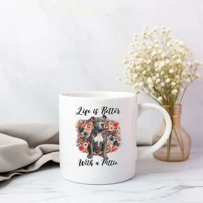 a white coffee mug with a dog on it