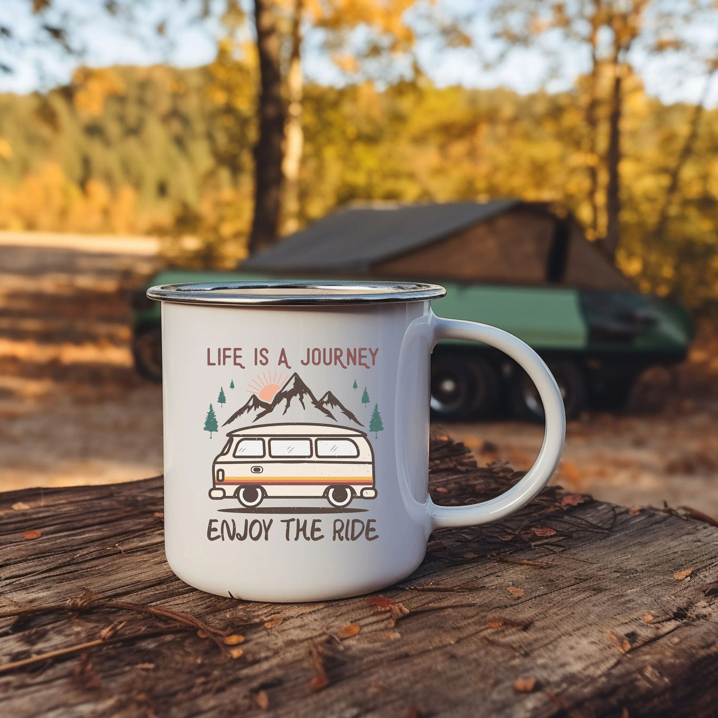 a camper mug sitting on top of a tree stump