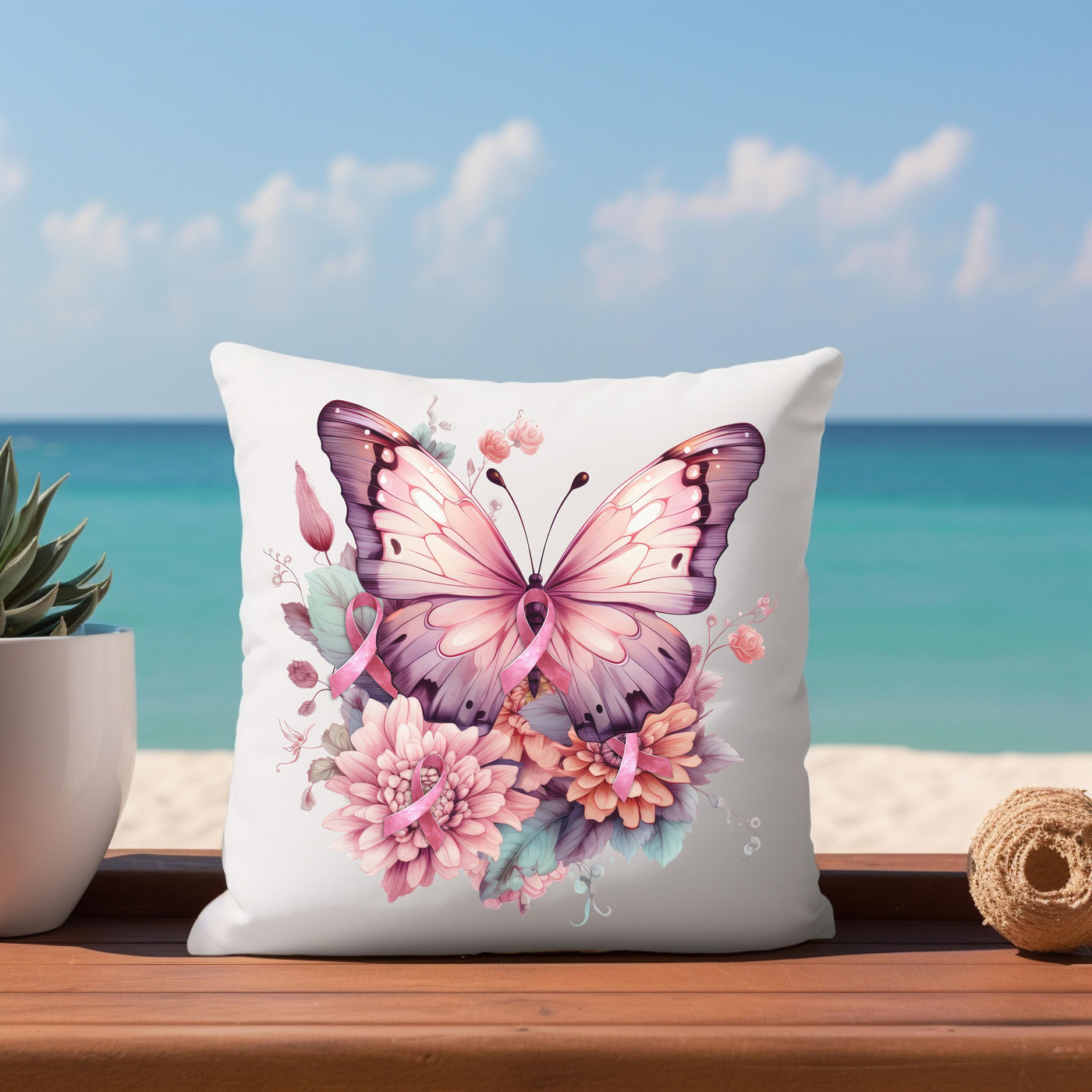 a white pillow with a pink butterfly on it