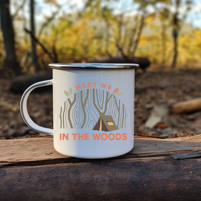 a camp mug sitting on top of a log