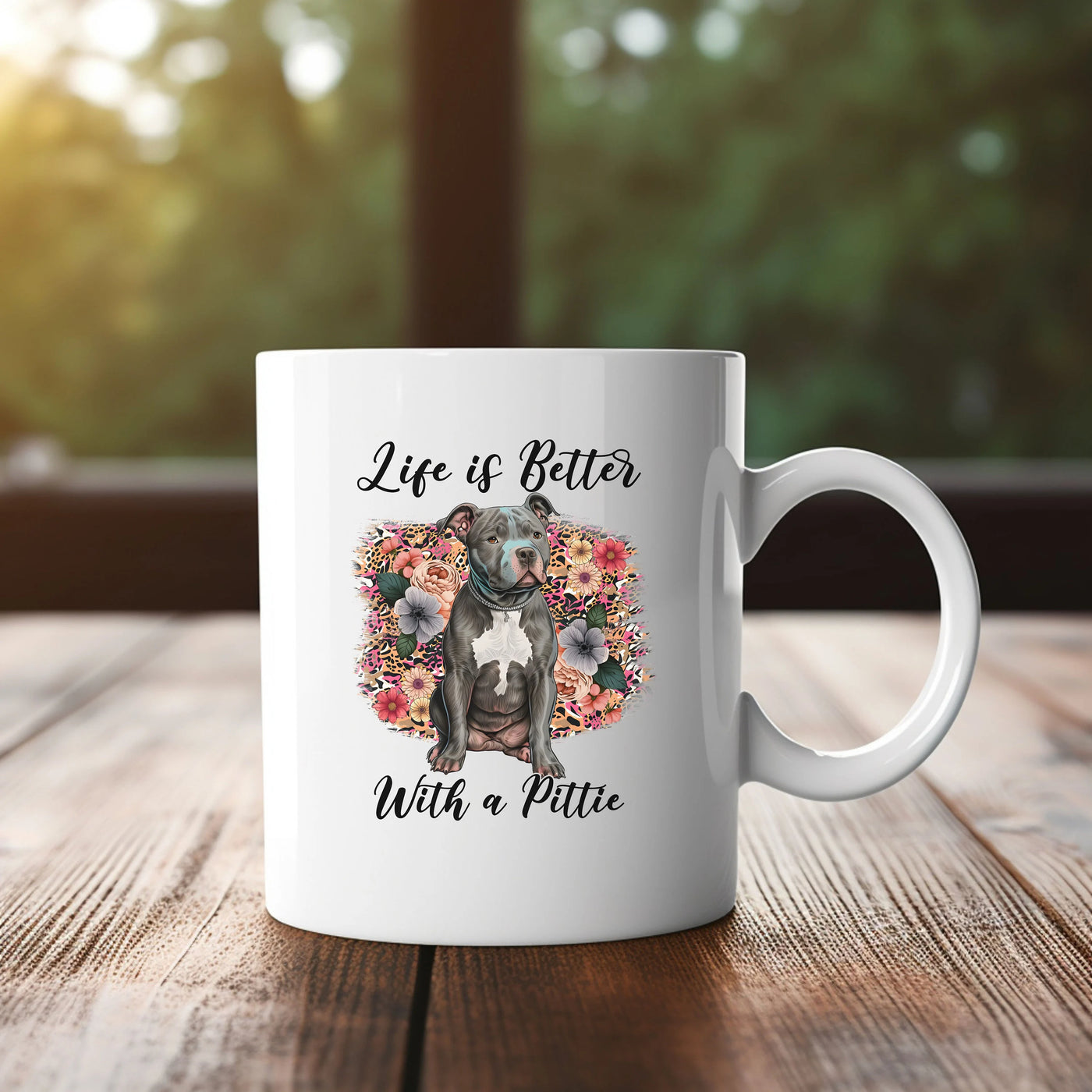 a white coffee mug with a picture of a pitbull on it