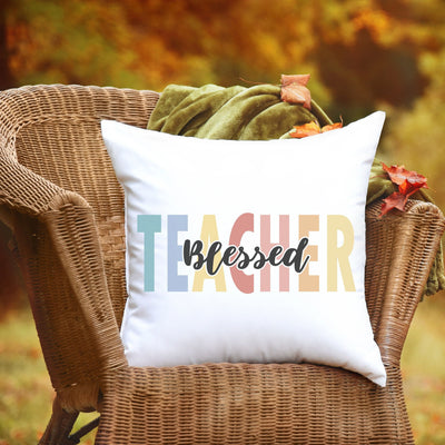 a chair with a pillow that says teacher on it