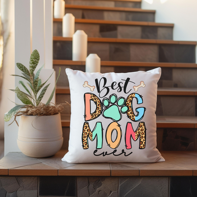 a dog mom pillow sitting on top of a wooden table