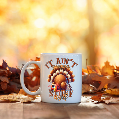 a white coffee mug with a turkey on it