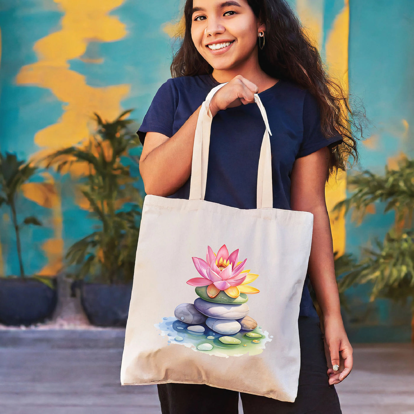 a woman holding a bag with a picture of a flower on it