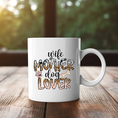 a white coffee mug sitting on top of a wooden table