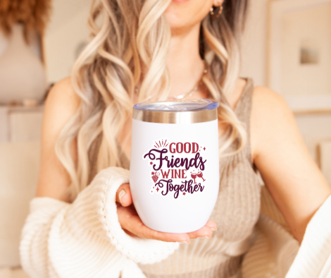 a woman holding a wine glass that says good friends