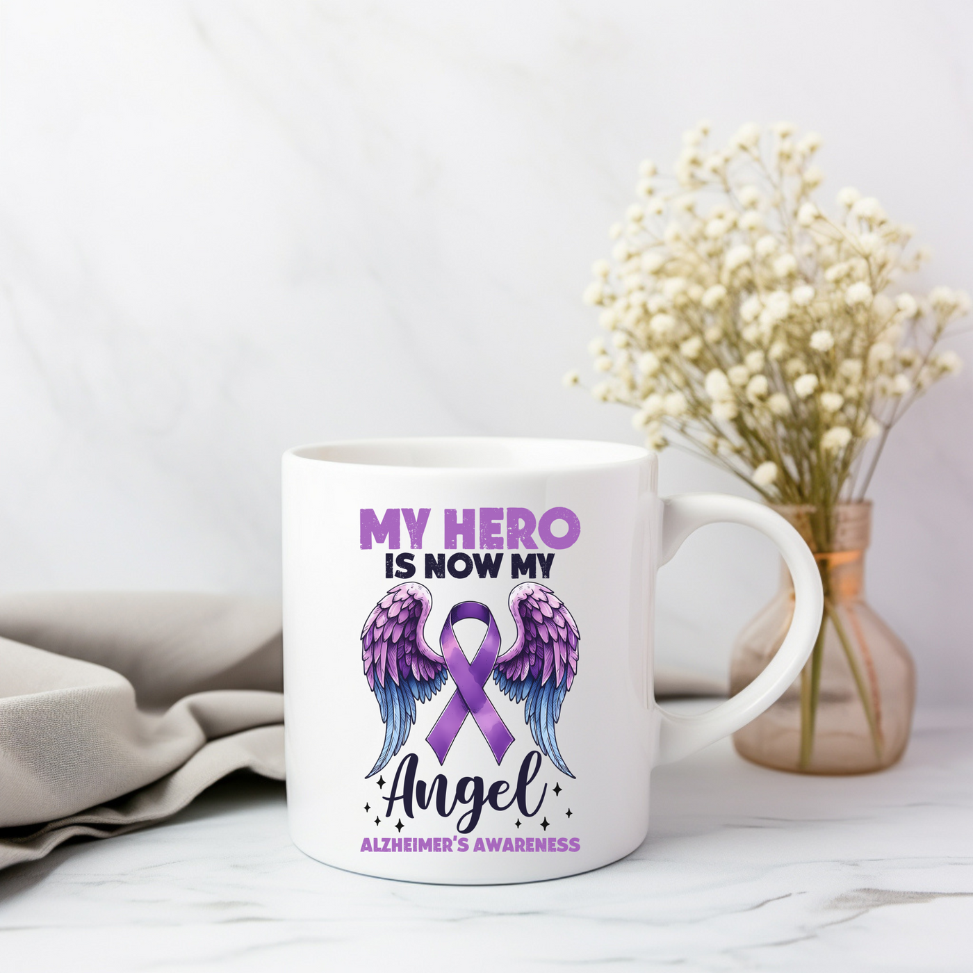 a coffee mug with an angel design on it