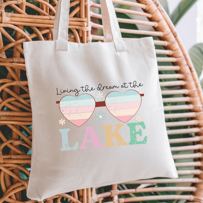 a tote bag hanging on a wicker chair