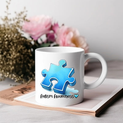 a white coffee mug with a blue puzzle piece on it