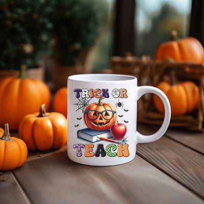 a white coffee mug with a trick or treat on it