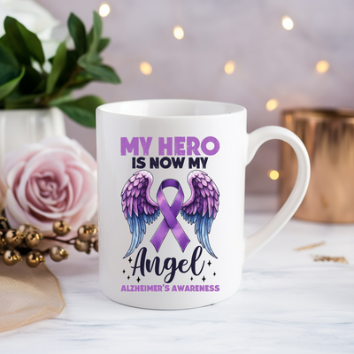 a coffee mug with an angel design on it