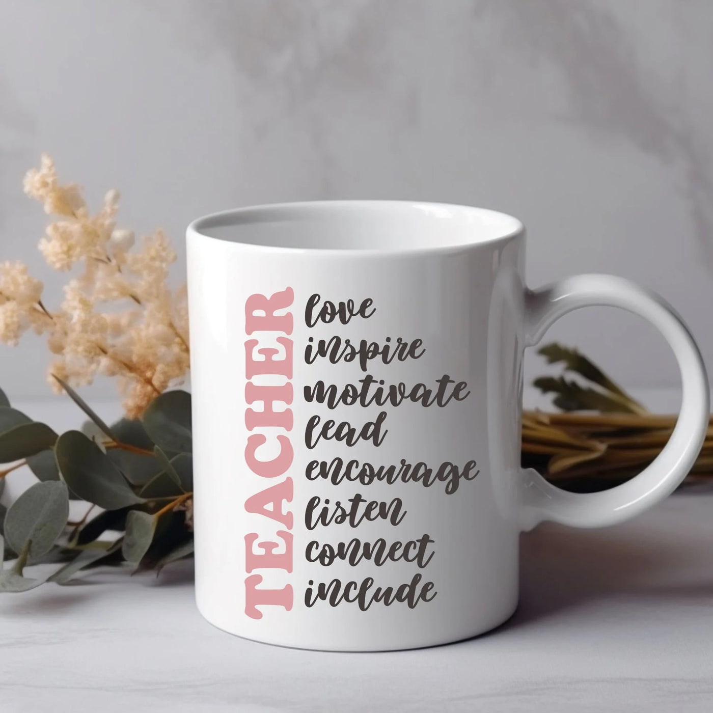 a coffee mug with the words teacher on it