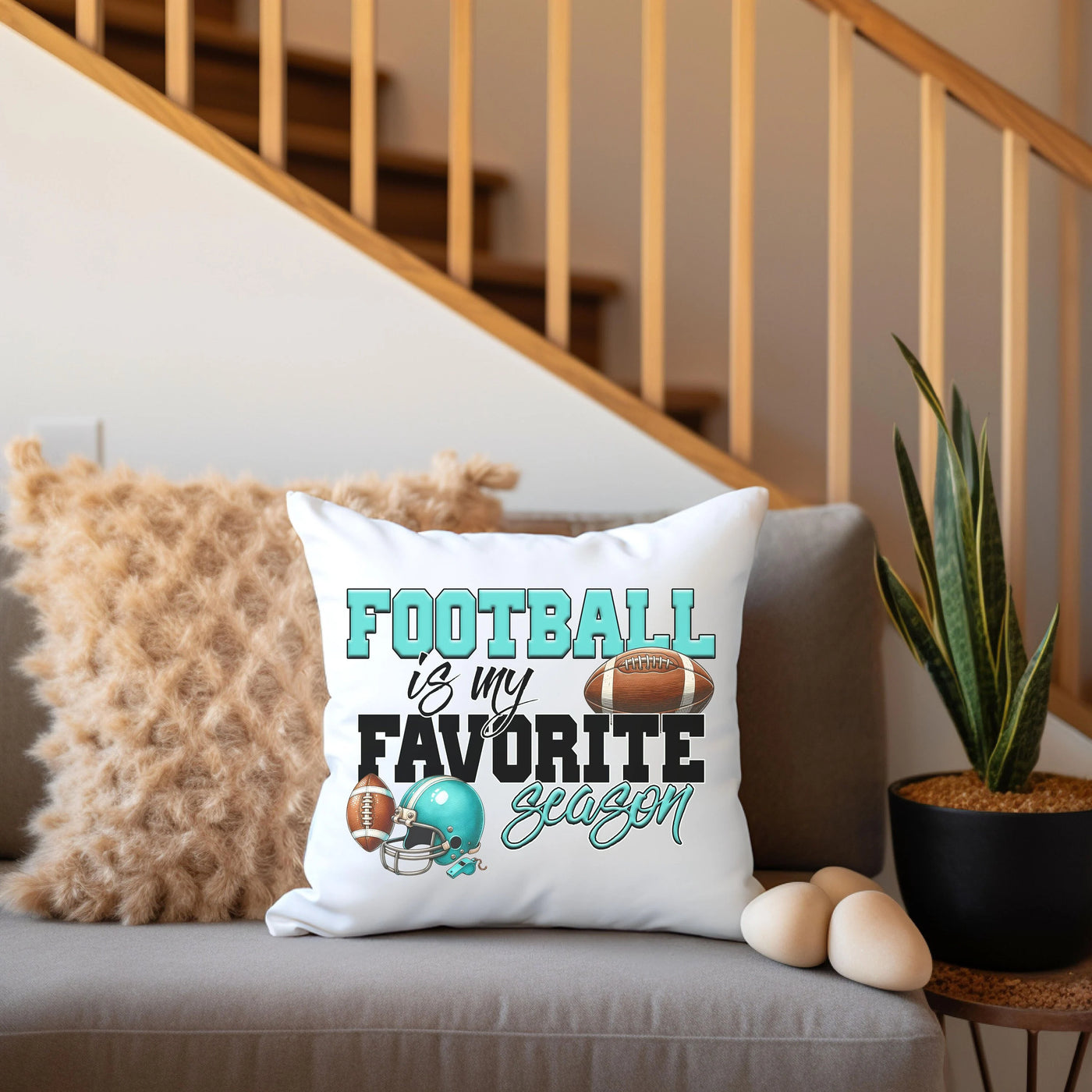 a couch with a pillow that says football is my favorite season