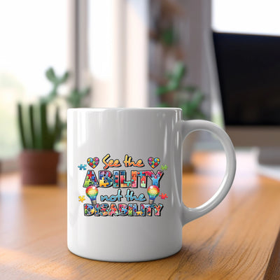 a white coffee mug sitting on top of a wooden table