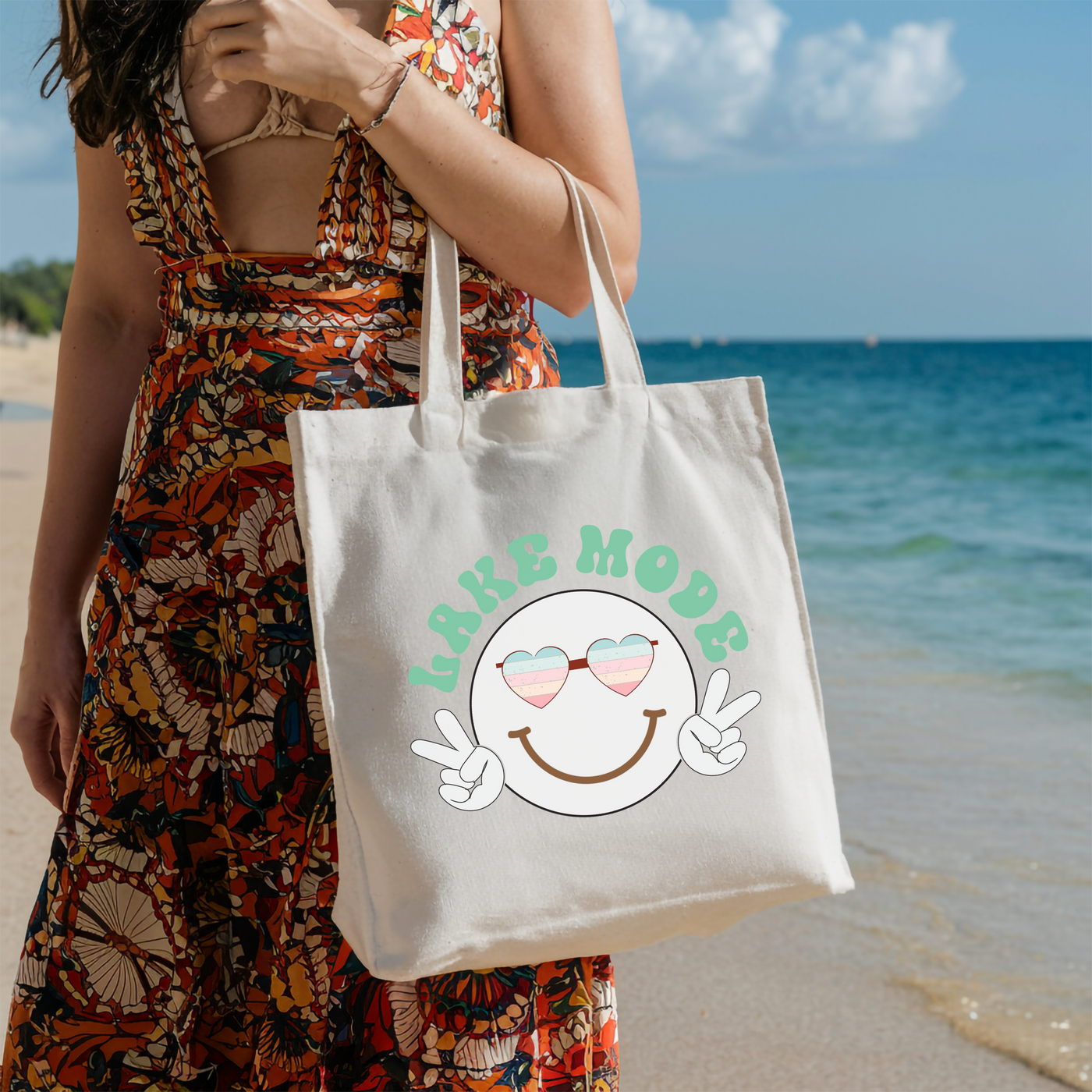 a woman holding a white bag with a smiley face on it