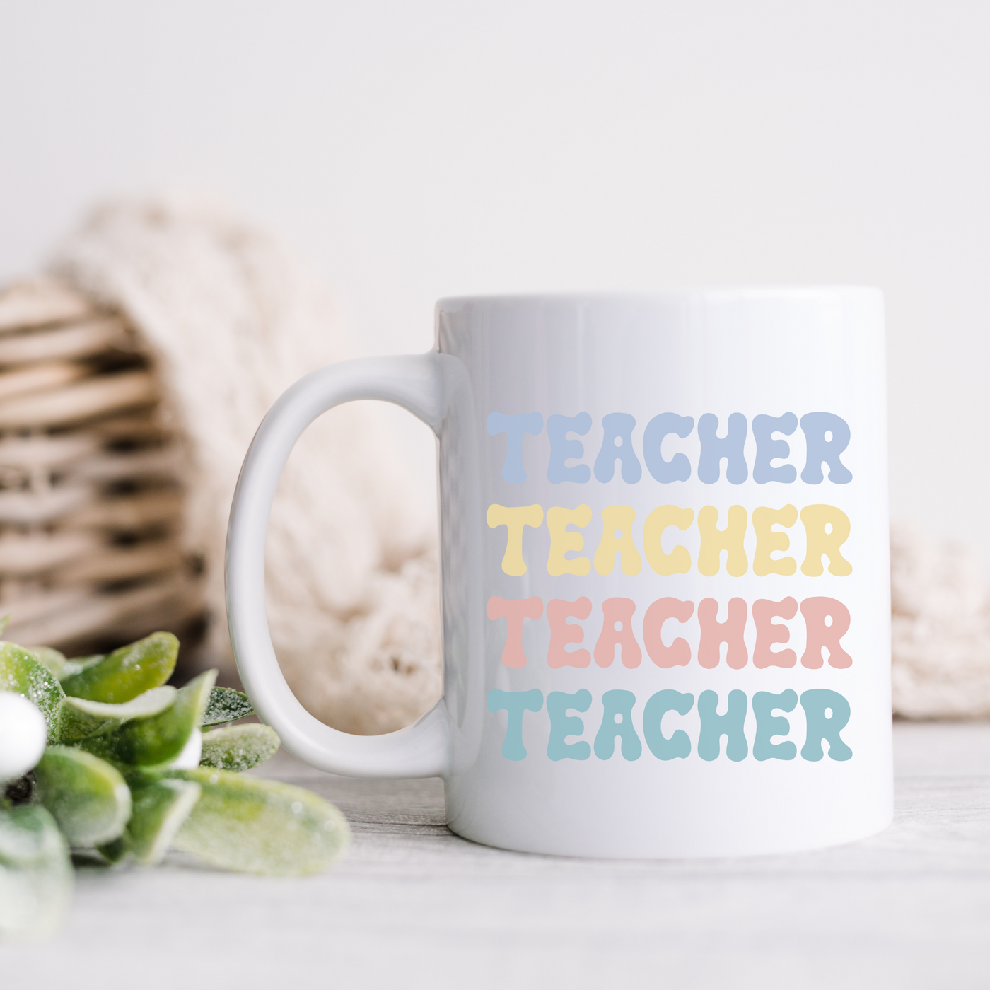 a white coffee mug sitting on top of a table